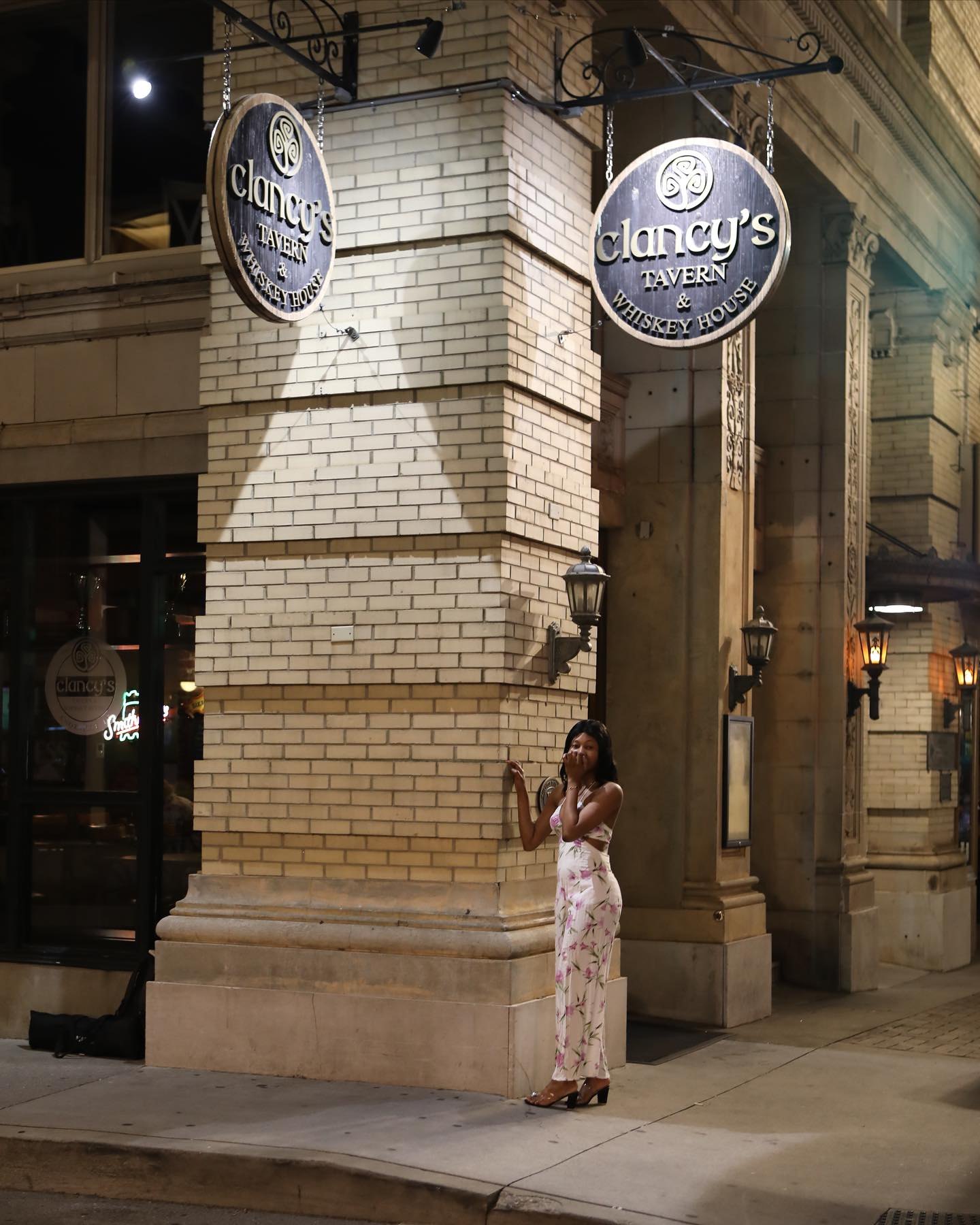 Editorial portrait outside a historic tavern at night